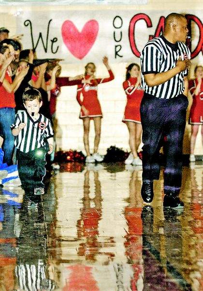 Eli Lambert runs the sidelines during a local basketball game