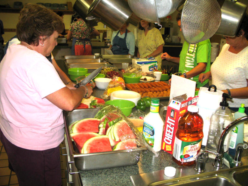 food preparation under way for vacation bible schools kids and adult volunteers